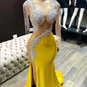 Yellow, shimmery prom dress. Very versatile.